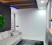 Фитопанно из мха на тёмной стене в гостиной